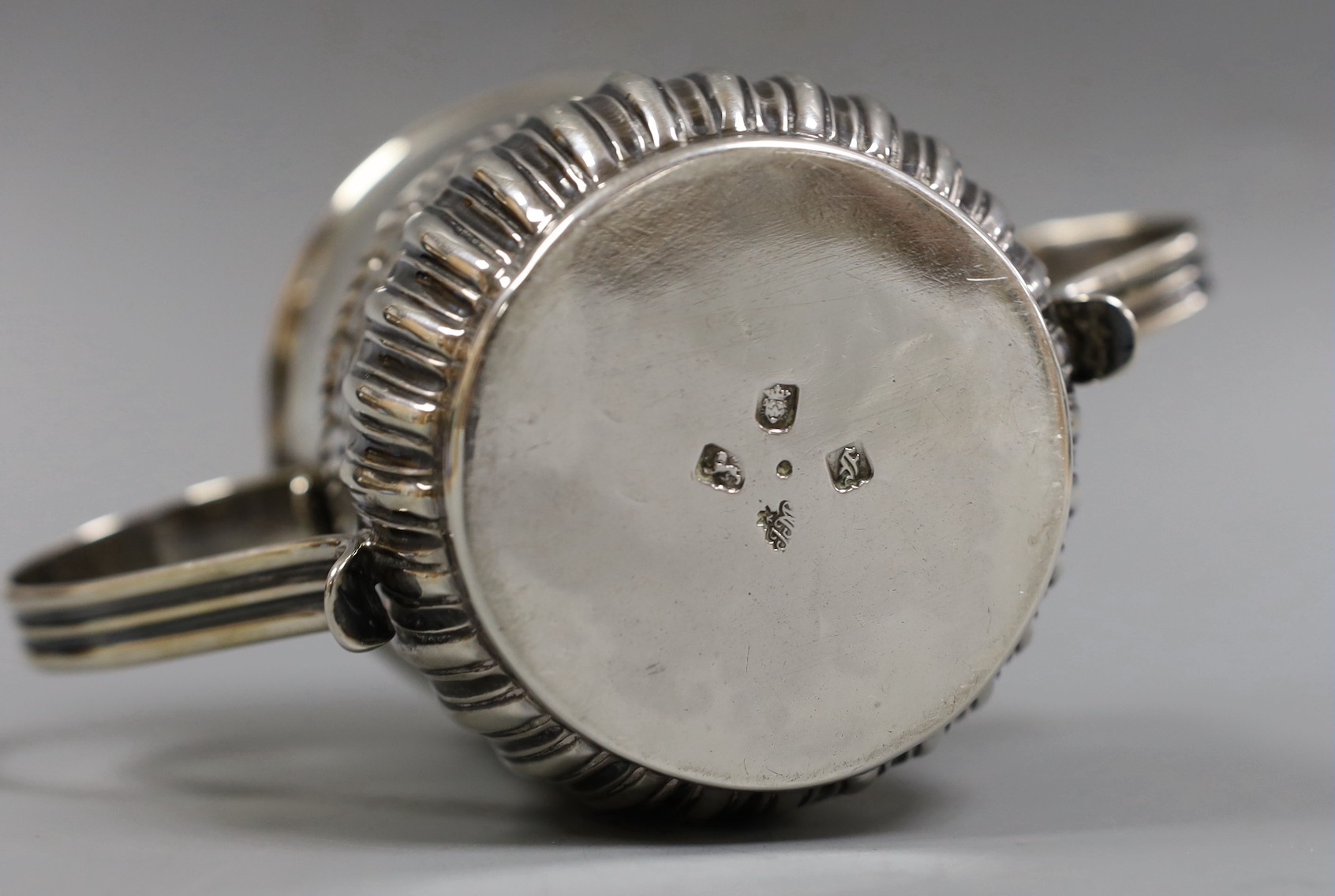 An early George III demi-fluted silver porringer, by John Moore, London, 1761, height 85mm, 7.2oz, with contemporary engraved date.
